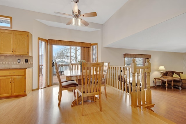 dining space with ceiling fan and light hardwood / wood-style floors