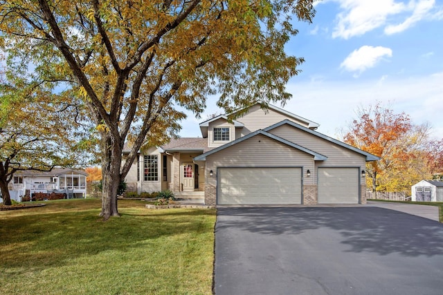 view of front of house with a garage and a front yard