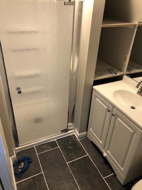 bathroom with vanity and tile patterned flooring