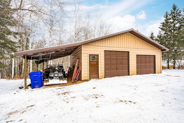 view of snow covered garage