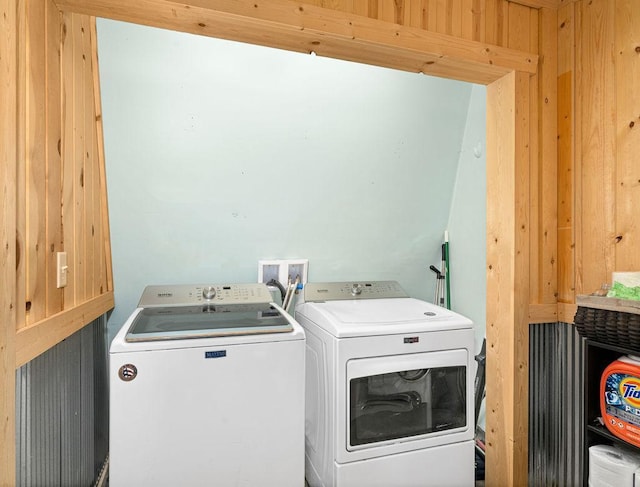 washroom with independent washer and dryer