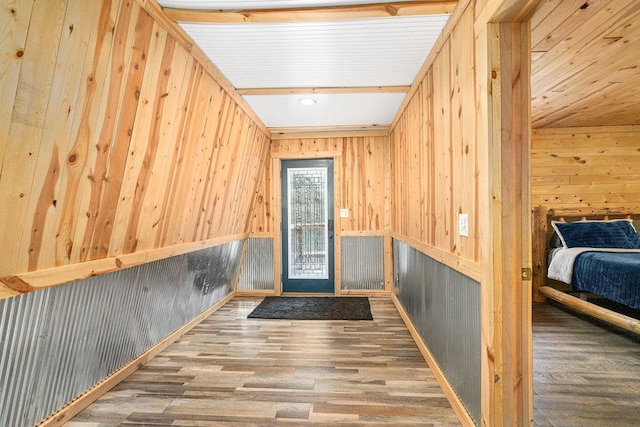 interior space featuring hardwood / wood-style flooring and wood walls