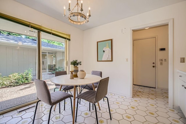 dining room featuring visible vents and an inviting chandelier