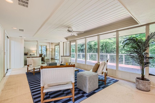 sunroom / solarium with ceiling fan and visible vents