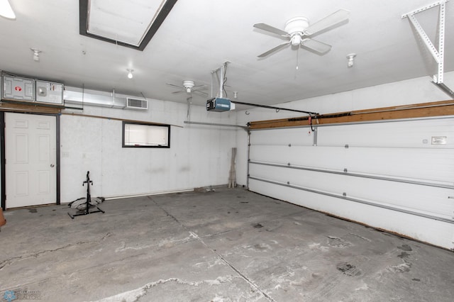 garage featuring visible vents and a garage door opener