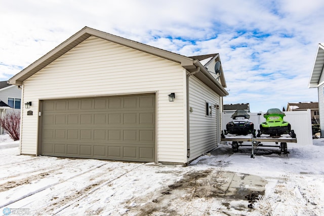 view of snow covered garage