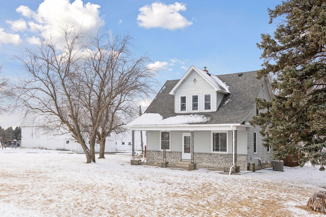 view of front of property with central AC unit and a porch