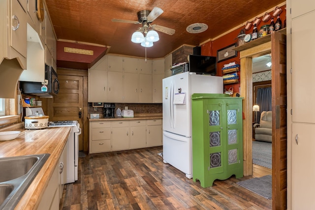 kitchen featuring white cabinetry, butcher block countertops, white appliances, and dark hardwood / wood-style floors