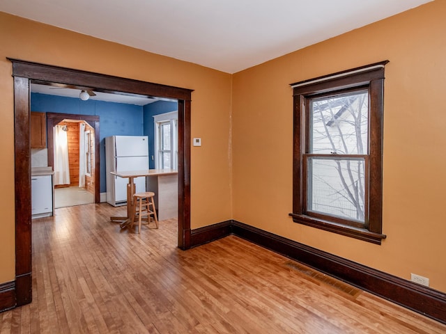 spare room with light hardwood / wood-style flooring