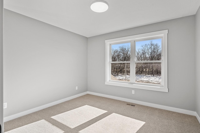 empty room with light colored carpet