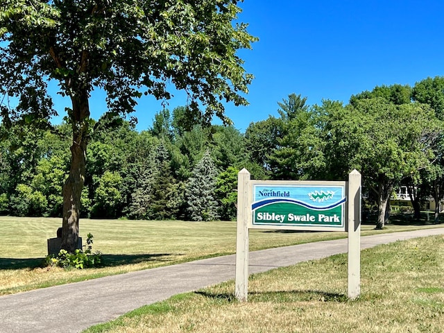 view of home's community with a yard