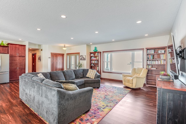 living area featuring recessed lighting, a textured ceiling, and dark wood-style flooring