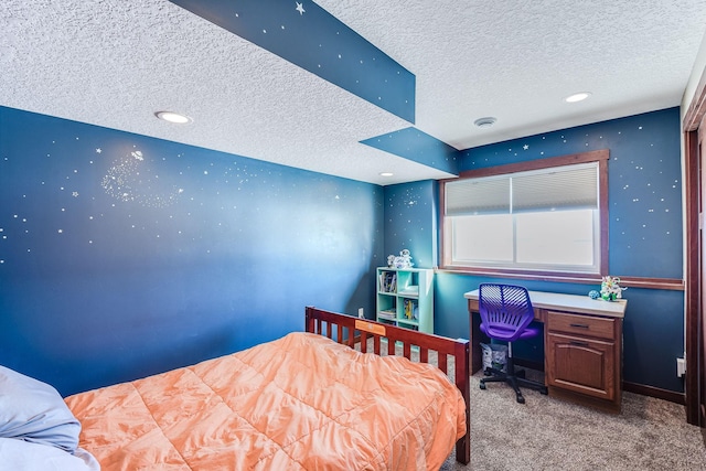 carpeted bedroom with baseboards and a textured ceiling