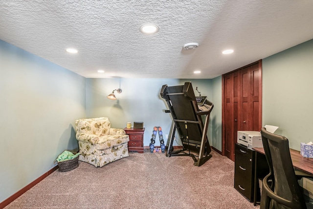 exercise room featuring recessed lighting, carpet, baseboards, and a textured ceiling