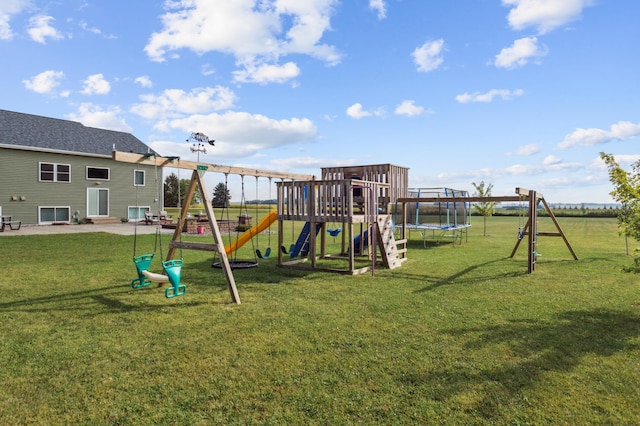 view of play area featuring entry steps, a patio area, a trampoline, and a lawn