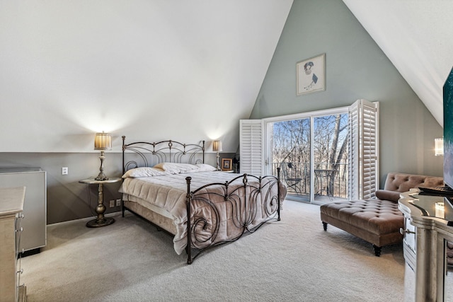 carpeted bedroom featuring high vaulted ceiling and access to outside