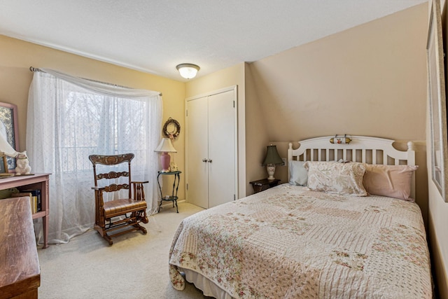 bedroom with carpet floors and a closet