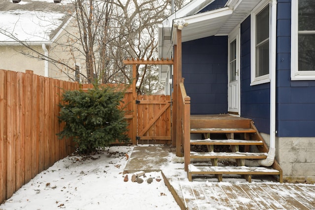 view of snow covered property entrance