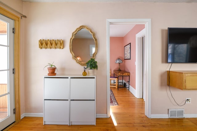 hall featuring light hardwood / wood-style floors