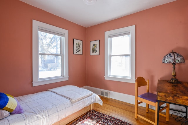 bedroom with wood-type flooring