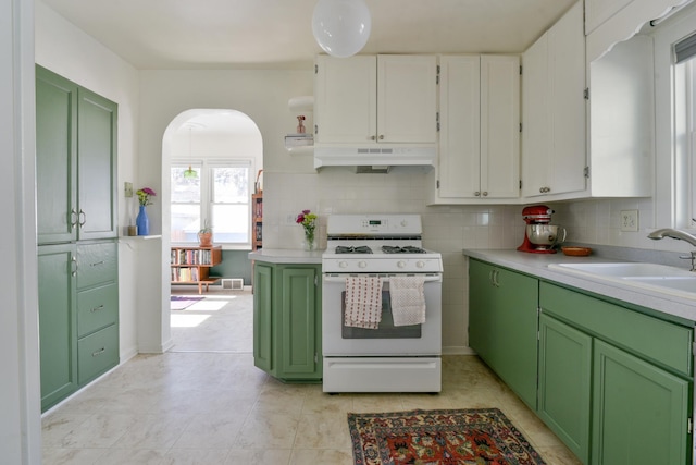 kitchen featuring green cabinets, sink, white gas range oven, and white cabinets