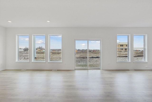 unfurnished room featuring light wood-type flooring