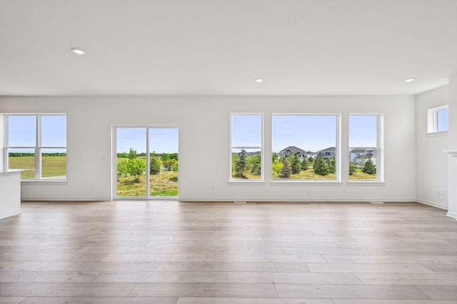 unfurnished room featuring light wood-type flooring