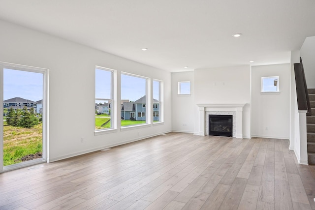 unfurnished living room with light hardwood / wood-style floors