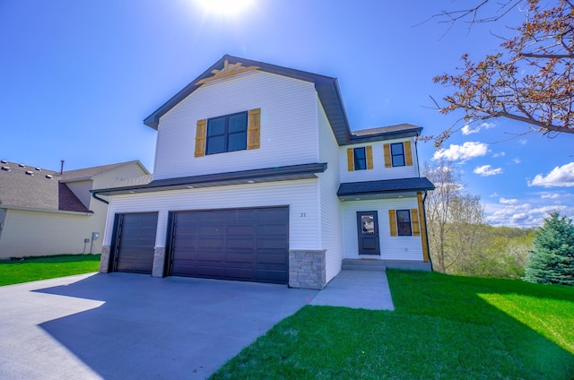 1205 Riverside Dr N, North Hudson, WI 54016 - view of front of house with a garage, driveway, a front lawn, and stone siding