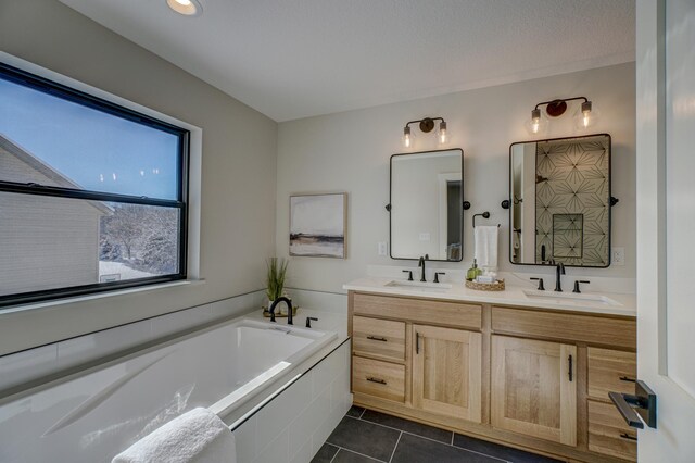 1205 Riverside Dr N, North Hudson, WI 54016 - full bathroom with a bath, double vanity, and tile patterned flooring