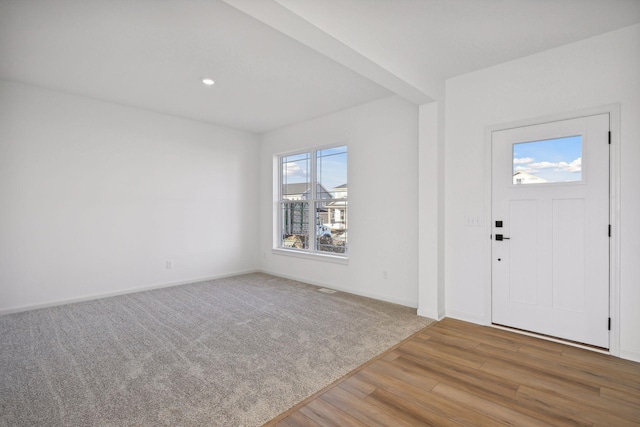 foyer entrance featuring wood-type flooring