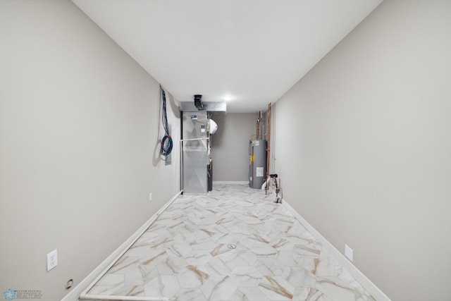 hallway with water heater and heating unit