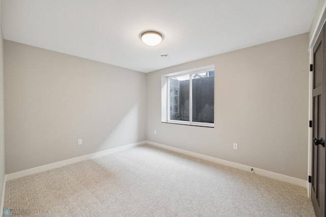 spare room featuring carpet floors