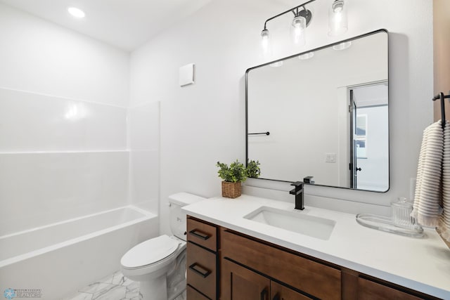 bathroom with toilet, marble finish floor, shower / bathing tub combination, and vanity