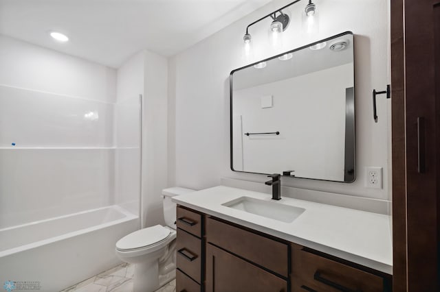 bathroom featuring toilet, marble finish floor, bathtub / shower combination, and vanity