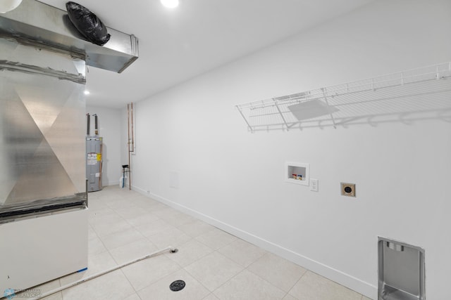 washroom featuring hookup for an electric dryer, water heater, baseboards, laundry area, and hookup for a washing machine