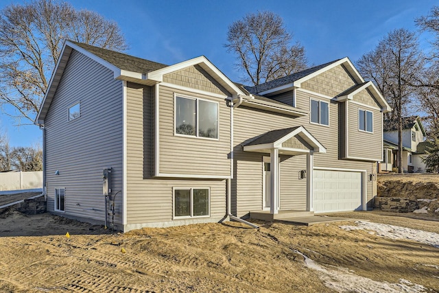 raised ranch featuring a garage