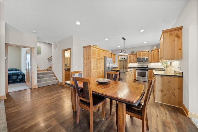 dining room featuring dark hardwood / wood-style flooring and sink