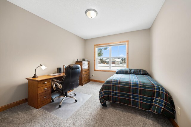 bedroom featuring light carpet