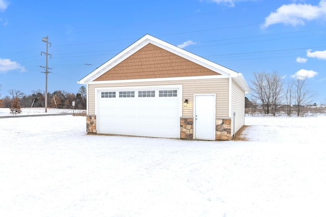 view of snow covered garage