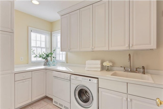 laundry area featuring washer / clothes dryer, light tile patterned floors, cabinets, and sink