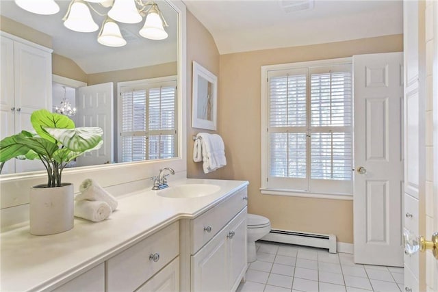 bathroom with lofted ceiling, toilet, vanity, tile patterned flooring, and a baseboard heating unit