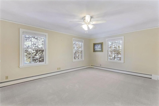 carpeted empty room featuring crown molding and ceiling fan