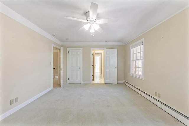 carpeted empty room featuring ceiling fan, ornamental molding, and a baseboard heating unit