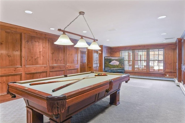 game room with a baseboard heating unit, light carpet, pool table, and wood walls