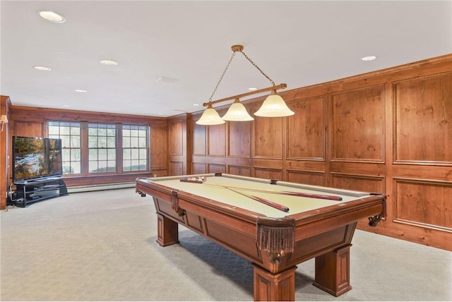 rec room featuring light carpet, a baseboard heating unit, wooden walls, and billiards