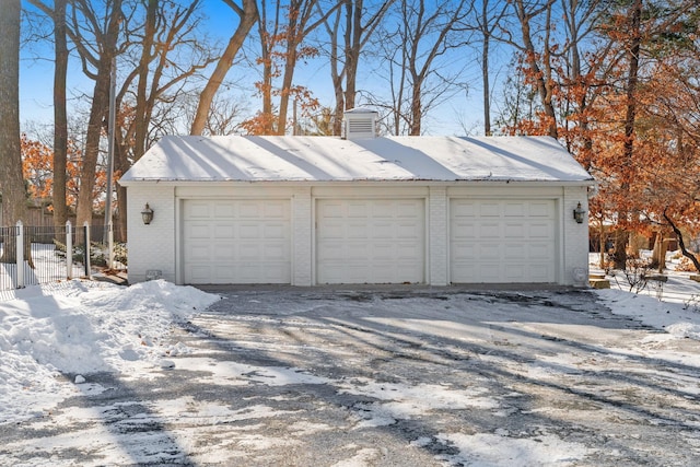 view of snow covered garage