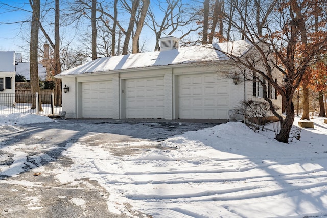 view of snow covered garage