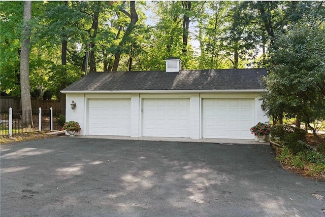 detached garage with fence