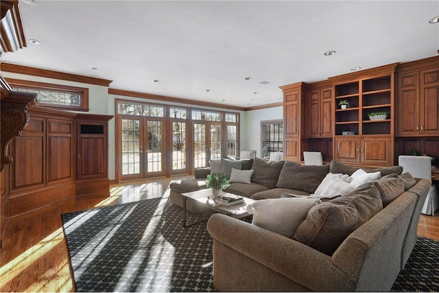 living area featuring recessed lighting, ornamental molding, and wood finished floors
